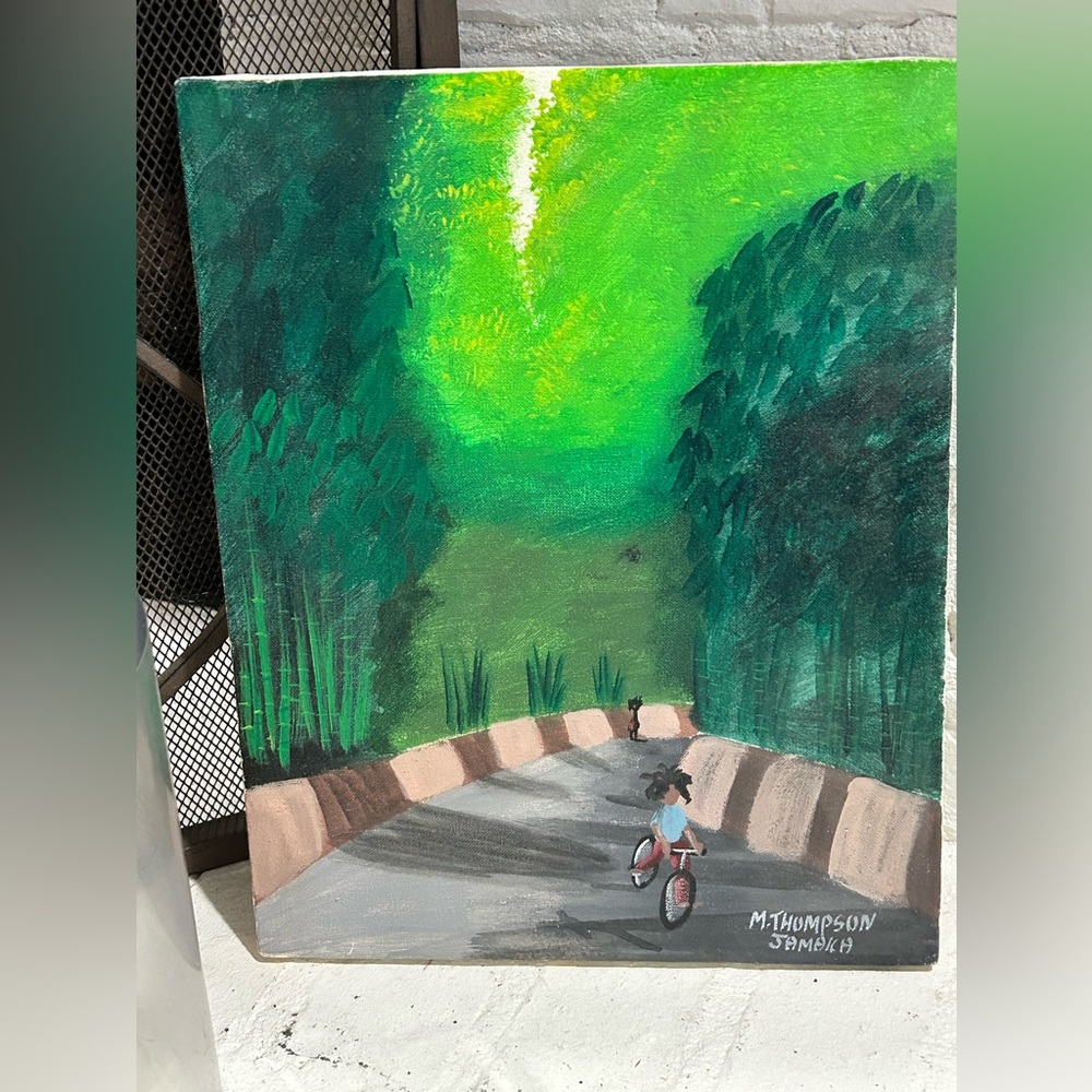Jamaican artist M. Thompson Painting child on bike lush greenery   Aprox 13”x10”